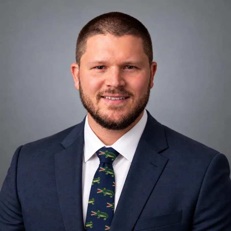 Louis Wright, in a navy suit and tie.